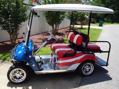 a golf cart with an american flag seat