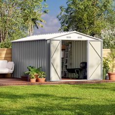 a garden shed sitting on top of a lush green field