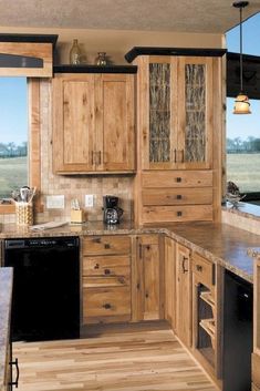 a kitchen with wooden cabinets and granite counter tops