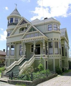 an old victorian style house with many windows and balconies