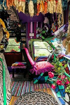 the interior of a bus with colorful decorations