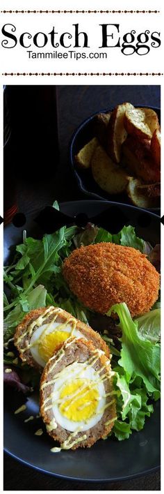 an egg and some lettuce on a black plate