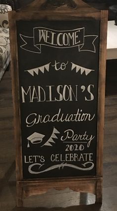 a chalkboard sign that says welcome to madison's graduation party let's celebrate