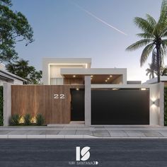 a modern house with two garages and palm trees