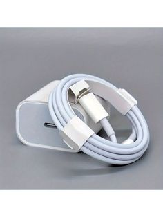 an iphone charger with a white cable attached to the charging unit and plugged into it