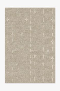 a beige rug with white arrows on the side and an off - white pattern in the middle