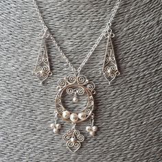 Antique Norwegian Dangly Silver Filigree Necklace - Edwardian Era 1910s 1920s style - 830 silver Marked 830s. Length of necklace 43cm. Size of big dangle 6.5cm x 3.1cm. Barrel clasp.  I spent quite some time cleaning this back to its former glory so it is ready to wear, perfect for a wedding or special occasion.  Wear commensurate with age. All my items are Antique, Vintage & Preloved, please expect age related wear & tear. Please refer to pictures for more detail. I do my best to describe produ 1920s Style, Filigree Necklaces, Bib Necklaces, Edwardian Era, 1920s Fashion, Silver Filigree, Rock Crystal, Antique Vintage, Occasion Wear