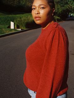 A twist on another classic, featuring a crew neckline, balloon sleeves with an open cuff, ribbed waist, and pleated shoulders with a single-sided placket for a feminine, button detail. (This one comes in Curtain Call.) | Women's Vivi Sweater Top in Curtain Call | Ethical Essentials Red Long Sleeve Sweater With Button Closure, Playful Red Cotton Sweater, Red Fine Knit Wool Sweater, Playful Long Sleeve Red Sweater, Red Textured Knit Crew Neck Sweater, Curtain Call, Balloon Sleeves, Button Detail, Sweater Top