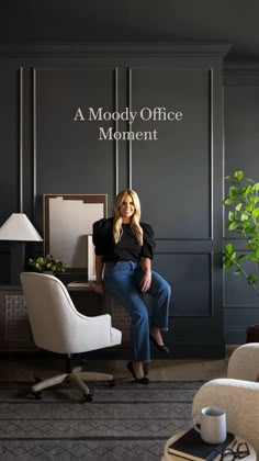 a woman sitting on a chair in front of a wall with the words mood office moment