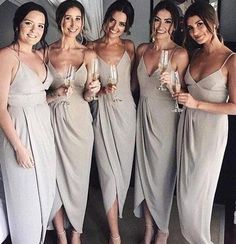 the bridesmaids are holding champagne flutes in their hands