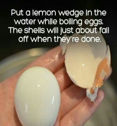 someone holding an egg in their hand with the quote put a lemon wedge in the water while boiling eggs