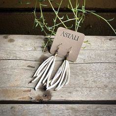 -These tassel earrings are made from soft white deerskin leather.  Part Western, part Boho, part Rock 'n Roll, these little fringe earrings give a big kick to any outfit.-Lightweight enough to wear every day. -3" - 3.5" total length, including earwires.-Earwires are antique-brass.-Deerskin leather is sustainably sourced in the USA.-Ok to get wet.-Available in 10 colors.-Designed and handmade in South Pasadena, CA.Check out more of our awesome earrings here:https://www.etsy.com/shop/ASTALIJewelry White Bohemian Leather Jewelry, White Leather Bohemian Jewelry, Bohemian White Leather Jewelry, Handmade White Leather Earrings, White Leather Earrings As A Gift, White Leather Earrings Gift, White Leather Earrings For Gift, Dangly Earring, Creepy Earrings