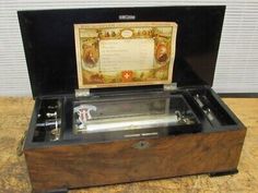 an old fashioned record player in a wooden case