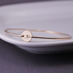 Initial Bracelet, Custom Gold Initial Bangle Bracelet, Monogram Bangle Bracelet. $36.00, via Etsy. Simple Bangle Cuff Bracelet Gift, Simple Cuff Bangle Bracelet As Gift, Adjustable Simple Cuff Bracelet As Gift, Classic Friendship Bangle Bracelets, Elegant Bangle Bracelet For Personalized Gift, Classic Bangle Bracelets For Friendship, Simple Adjustable Bangle As A Gift, Minimalist Personalized Bangle For Everyday, Rose Gold Minimalist Bangle As Gift