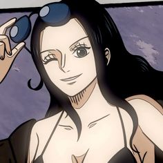 a woman with long black hair and blue eyes is looking at something in the distance