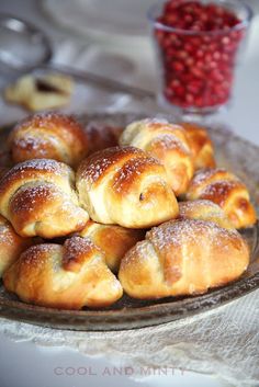 a plate filled with croissants on top of a table