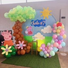 balloons and decorations are arranged in the shape of peppa pig's garden scene