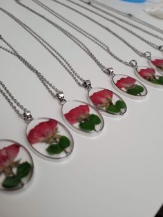 The charm for the necklace is made from epoxy resin with a real pressed flower inside. The flower is a rose bud from Idaho. It has a metal base around the charm, which matches the chain. It is very lightweight and perfect for any occasion, whether formal or casual. Rose Flower Jewelry With Pressed Flowers, Rose Flower Shaped Jewelry With Pressed Flowers, Green Goddess, Kind Person, Rose Bud, Wing Earrings, Pressed Flower, A Rose, Real Flowers