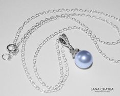 Wedding Swarovski 8mm Light Blue Pearl Drop Pendant with .925 Sterling Silver Chain Bridal Necklace. CHAIN is 18 inches (45.7cm) long. PENDANT is about 0.75 inch (2cm) long including bail. Elegant and timeless, this dainty necklace is perfect for weddings or special occasions such as birthdays, anniversaries, graduations, proms...or whatever you can imagine! Handmade necklace, is with .925 Sterling Silver 18 inches cable chain, Swarovski 8mm Light Blue round crystal pearl, Rhodium Sterling Silve Elegant Light Blue Round Pendant Necklace, Elegant Light Blue Necklaces For Gifts, Blue Round Pendant Jewelry For Wedding, Blue Pearl Pendant Jewelry For Wedding, Formal Blue Necklace With Pearl Pendant, Blue Round Pendant Necklace For Wedding, Blue Sterling Silver Jewelry For Bridesmaid Gift, Sterling Silver Blue Jewelry For Bridesmaid Gift, Blue Round Pendant Necklaces For Weddings