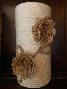 a roll of jute with two flowers on it