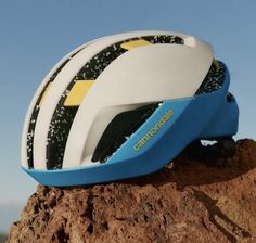 a close up of a helmet on top of a rock