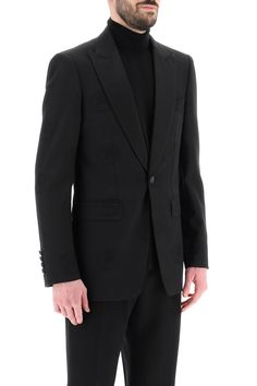 This tuxedo jacket is a mix of classic elegance and modern style, perfect for the man who appreciates subtle details. It's designed for a sleek fit, offering a confident and sophisticated look for any special occasion. Crafted with care in Italy, this jacket is both stylish and comfortable, making it a staple in any wardrobe. Made from a luxurious blend of wool and cotton cady Features a unique tone-on-tone jacquard coat of arms design Satin-covered peaked lapels add a touch of refinement Comfor Jacquard Coat, Jacquard Jacket, Tuxedo Jacket, Leather Cap, Denim Pant, Roberto Cavalli, Coat Of Arms, Victoria Beckham, Chest Pocket