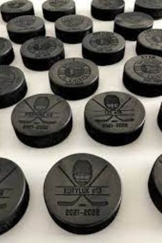 hockey pucks are lined up on the table