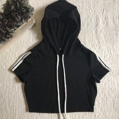 Nwot Black Cropped Pullover Hoodie Size M Short Sleeve With White Stripes On Sleeve Stretchy Material Smoke Free Home Will Ship Priority Mail Within 24 Hours Of Purchase! Trendy Hooded Top With Ribbed Cuffs, Trendy Hooded Tops With Ribbed Cuffs, Black Sportswear Top With Drawstring Hood, Sporty Top With Adjustable Hood For Streetwear, Spring Black Hoodie With Double-lined Hood, Black Stretch Hoodie Top, Trendy Black Top With Drawstring Hood, Casual Black Hoodie Top, Black Drawstring Hood Top For Streetwear