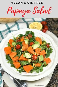 a white plate topped with salad and avocado