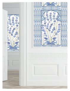 an open door with blue and white tiles on the outside, and floral designs on the inside