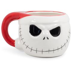 a coffee mug with a face painted on the front and sides, in white and red