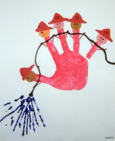 a child's hand is painted in pink and blue