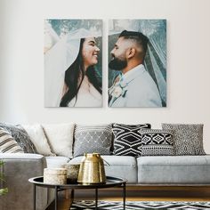 two pictures of a bride and groom are hanging on the wall in this living room