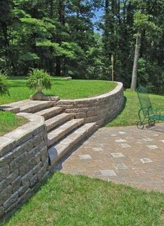 a stone wall in the middle of a park