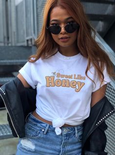 Sweet Like Honey.  This retro 70s vibe shirt is sure to turn a few heads. Super cute, trendy design on a soft tshirt is the best of both worlds. → Find more fun tees here: beyondwordsct.etsy.com * Q U I C K * F A C T S * ⭑ Premium quality fabric cotton ⭑ Thick - soft - comfy ⭑ Design is high quality digitally printed ⭑ Wash cold, inside out, air dry is best but regular wash/dry is fine as well * S I Z I N G * ⭑ Sizing is unisex: not skin tight and not overly large. ⭑ Most women find their typica Retro Slogan Tops, Retro Slogan Crew Neck Shirt, Retro Slogan Shirt With Crew Neck, Retro Crew Neck Shirt With Slogan, Retro Slogan Shirt For Spring, Retro Crew Neck Shirt With Funny Print, Vintage Slogan Crew Neck Shirt, 60s Clothing, Honey Shirt