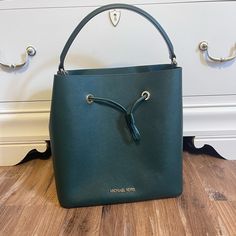 Michael Kors Suri Saffiano Leather Bucket Bag In Racing Green. New, Never Used. Excellent Condition. Comes With Tags And Shoulder Strap. 9x8x4.5 Smoke And Pet Free. Originally Priced 398 Green Top Handle Bucket Bag For Formal Occasions, Elegant Green Top Handle Bucket Bag, Elegant Green Bucket Bag For Shopping, Formal Green Bucket Shoulder Bag, Elegant Green Tote Bucket Bag, Green Formal Bucket Bag With Detachable Handle, Formal Green Bucket Bag With Removable Pouch, Green Formal Bucket Bag, Elegant Green Leather Bucket Bag