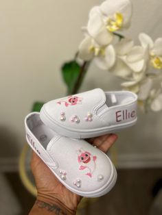 Welcome to our Etsy shop, where you can find adorable slip-on shoes inspired by the beloved Baby Shark song! Our custom-designed shoes are crafted to capture the fun and playful spirit of the Baby Shark craze, featuring vibrant colors and cute shark-themed designs. Each pair is perfect for little ones who love to sing and dance along to the catchy tune. Let your child's imagination swim with delight as they step into their own underwater adventure with our Baby Shark-inspired slip-on shoes. Dive into the world of joy and laughter with these delightful and comfortable shoes! Blippi Shoes, Baby Shark Song, Sing And Dance, Designed Shoes, Cute Shark, Dora The Explorer, Sneakers Athletic, Baby Shark, Orlando Fl