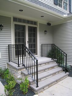 the front door and stairs of a house