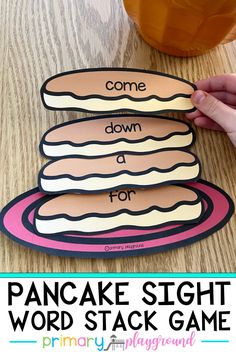 a hand holding a piece of paper that says, come down for pancakes sight word stack game