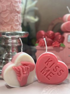 two heart shaped soaps sitting on top of a table next to a pink truck