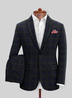 Project your business-like demeanor with a tailored Italian Loza Checks Tweed Suit that conservatively resembles luxury. Crafted with a wool blend, our suit has a solid and stylish plaid pattern of slight green checks over a royal blue framework that will become a favorable piece in your closet. Also, this piece has a comfort feature which is the essence of any couture. So don our suit that fulfills your wish to be in the spotlight on any occasion. 
 
 Look features a 2 button jacket with notch Green Wool Suit With Suit Collar, Fitted Green Wool Suit, Green Fitted Wool Suit, Tailored Green Winter Suit, Green Fitted Tweed Jacket With Notch Lapel, Fitted Green Tweed Jacket With Notch Lapel, Fitted Green Tweed Jacket With Welt Pockets, Formal Tailored Green Tweed Jacket, Plaid Semi-formal Winter Suit