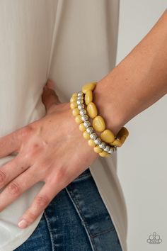 Varying in size, yellow and silver beads are threaded along stretchy bands, creating colorful layers across the wrist. Sold as one set of three bracelets. Yellow Bracelet, Mobile Boutique, Jewelry Show, Paparazzi Accessories, Stretchy Bracelets, Paparazzi Jewelry, Love Is Free, One Set, Jewelry Party