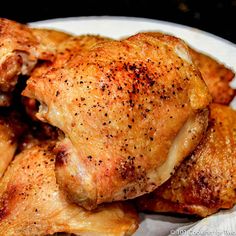 some chicken is sitting on a white plate