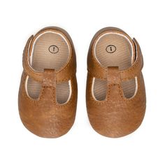 Not only do they have an elastic stretch, but they are so easy to get on and off! All of our moccasins are designed to stay on your child's feet, and the Moxford® is no exception! Each shoe is lined with cotton to keep the foot dry and warm. Sizes 4 and up have hard soles for any new walking babe in your home! To ensure ordering a proper size, please measure your child’s foot prior to ordering. We recommend adding 1/2″ to your child’s foot measurement for growing room. SIZING: sz 1 0 - 4 months Brown Non-slip Slip-ons, Brown Moccasins For Playtime With Round Toe, Brown Non-slip Closed Toe Slip-ons, Spring Brown Booties With Soft Sole, Comfortable Non-slip Brown Slip-ons, Casual Brown Non-slip Booties, Brown Slip-on Booties With Soft Sole, Brown Non-slip Slip-on Booties, Brown Non-slip Round Toe Moccasins