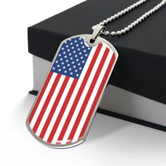 "Show off your national pride with our American Flag Dog Tag Necklace, a unique piece of patriotic jewelry that never goes out of style. Crafted with meticulous attention to detail, this dog tag necklace is perfectly patriotic. Whether you're a veteran or a proud patriot, this is a must-have addition to your jewelry collection. Our American Flag Dog Tag Necklace is made from high-quality stainless steel, ensuring durability and long-lasting shine. The dog tag measures approximately 28.5mm x 51mm and features an intricately designed American flag, beautifully painted with bold, vibrant colors. The necklace is completed with a sturdy 24-inch chain, perfect for everyday wear. But this necklace is more than just an accessory - it's a statement. When you wear our American Flag Dog Tag Necklace, Patriotic American Flag Jewelry For Independence Day, Patriotic American Flag Jewelry Gift, American Flag Jewelry For Independence Day Gift, Patriotic American Flag Jewelry For 4th Of July, American Flag Jewelry Gift For 4th Of July, American Flag Jewelry For 4th Of July Gift, American Flag Jewelry For 4th Of July, Patriotic Silver Jewelry For Independence Day, American Flag Jewelry