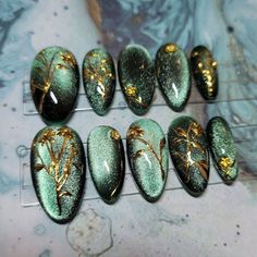 Green Cat-eye and Gold Chrome Floral Hand-painted Press-on Nails - Etsy Green Nails Magnetic, Fantasy Nails Acrylic, Elegant Green Nail Designs, Forest Green And Gold Nails Acrylic, Green Groovy Nails, Green Set Nails, Navy Burgundy Nails, Green Gemstone Nails, Cat Eye Nails Green And Gold