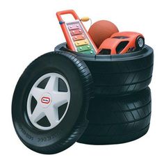 two toy cars are stacked on top of each other, with wheels and rims