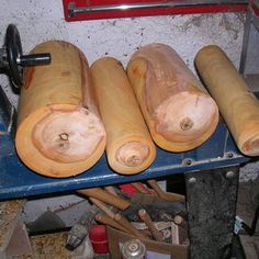 several pieces of wood are being worked on