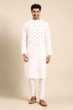 Ivory linen kurta with silver zari embroidery on the front yoke. Paired with a solid white pant. - Aza Fashions Elegant White Linen Kurta, Eid Linen Kurta With Embroidered Border, Wedding Linen Kurta With Resham Embroidery, Festive Linen Kurta With Embroidered Border, Ceremonial White Embroidered Kurta, Ceremonial White Kurta With Traditional Fit, White Linen Kurta With Resham Embroidery, Linen Traditional Wear For Festivals, White Linen Straight Kurta