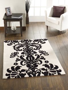 a black and white rug in a living room